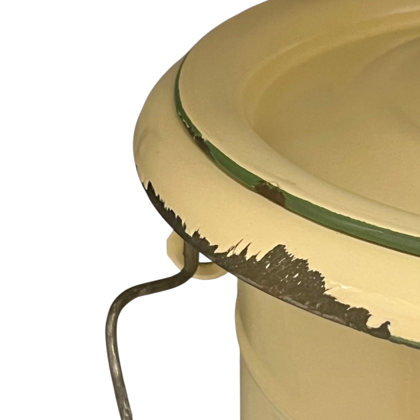 Close up of French vintage cream and green enamel bucket with a lid and handle on a white background