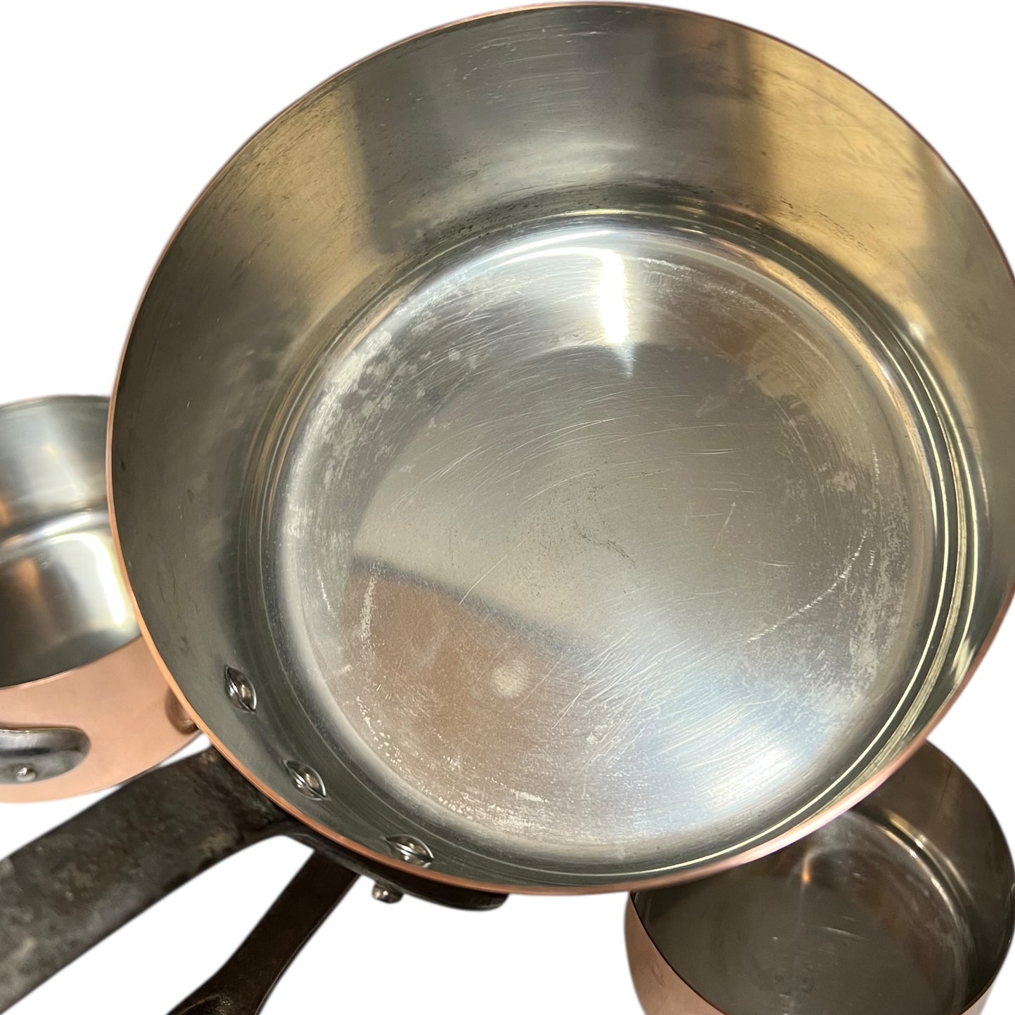 close up inside image of tin lined copper pan