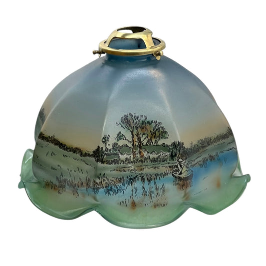 Decorative glass light fixture with landscape design on a white background