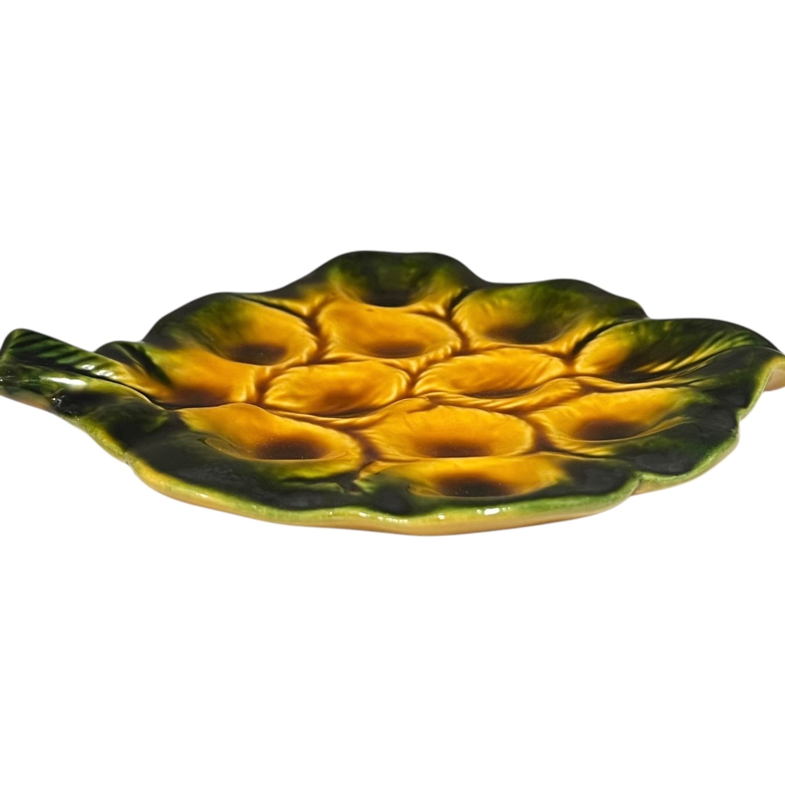 Yellow and green ceramic leaf-shaped snail escargots plate on a white background