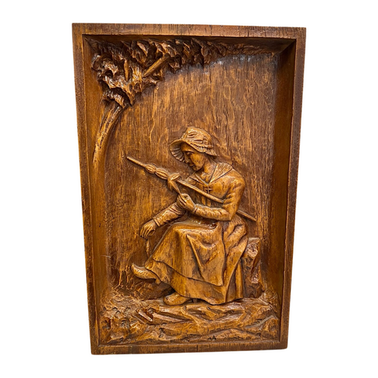 Wooden relief sculpture of a woman  on a white background