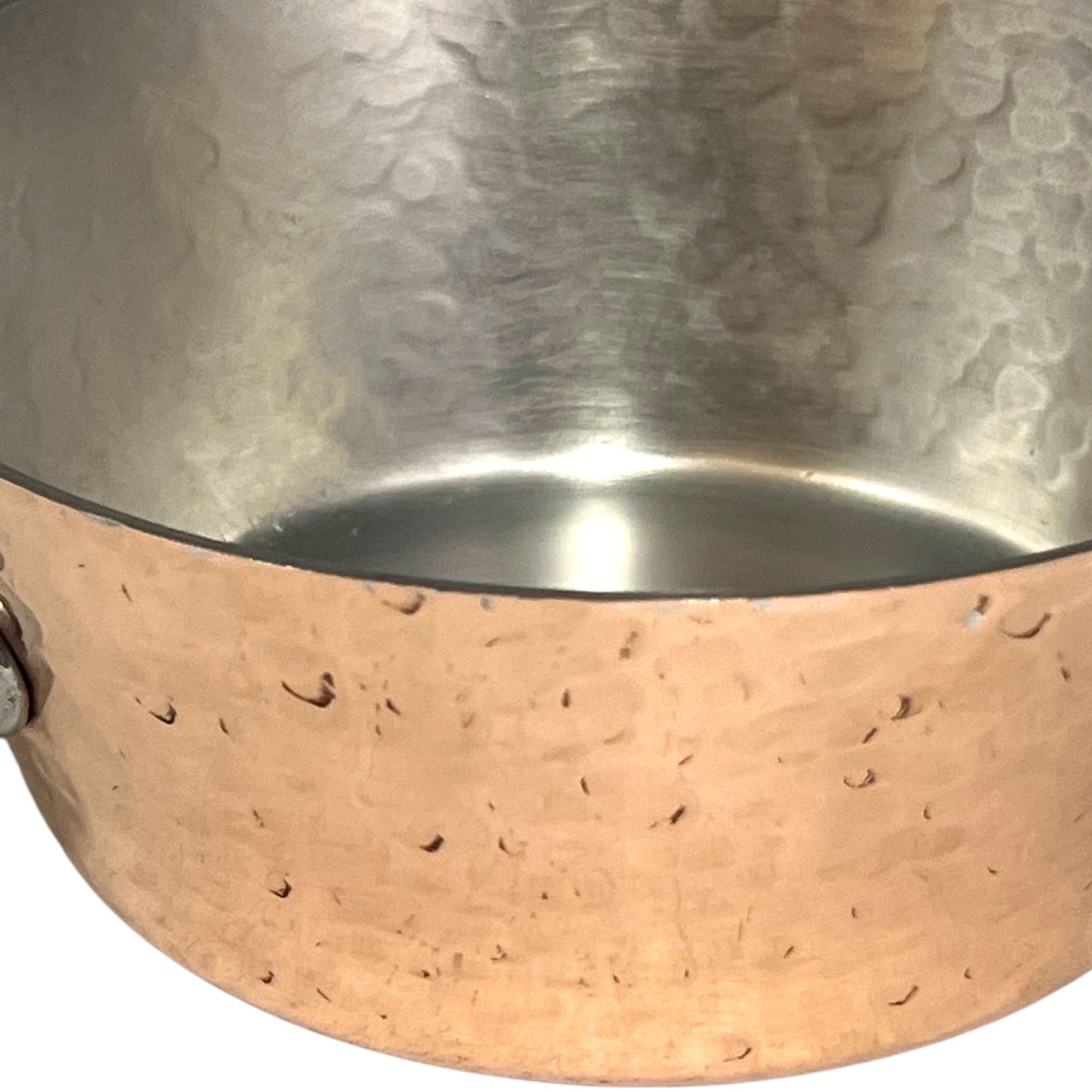 rim of copper saucepan