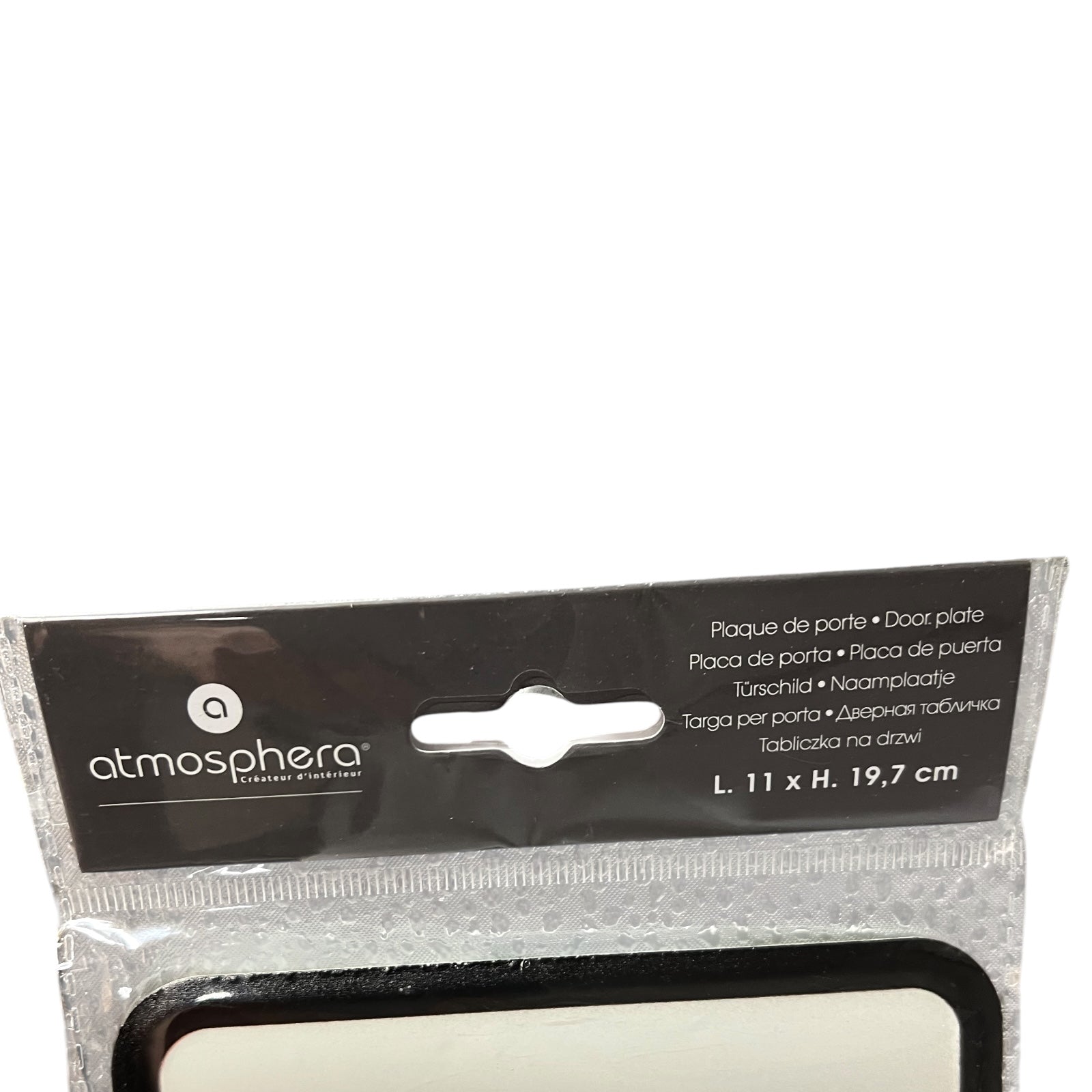 Packaged door plate with 'atmosphera' branding on a white background