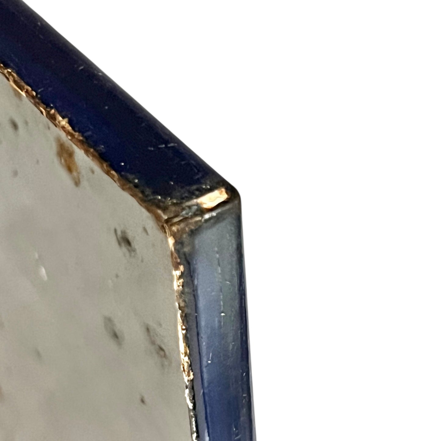 Close-up of a blue and white sign on a white background