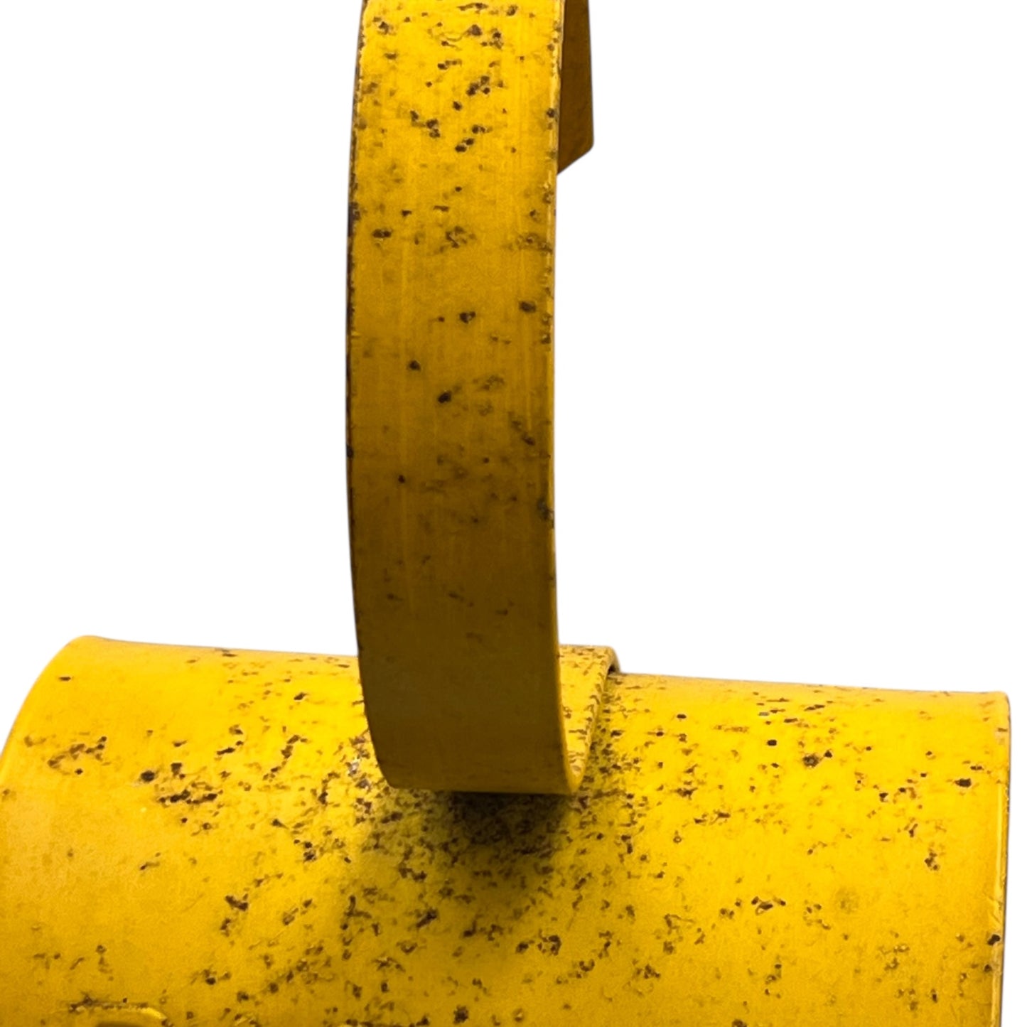 Close up of yellow vintage railway or railroad lamp with a hook on a white background