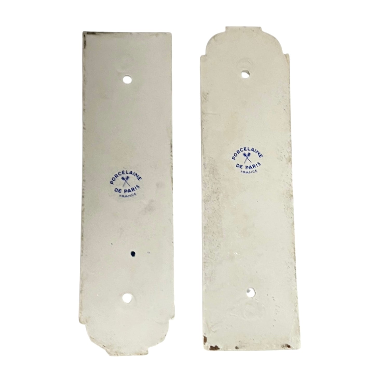 Two white ceramic plates with 'Porcelaine de Paris' branding on a white background