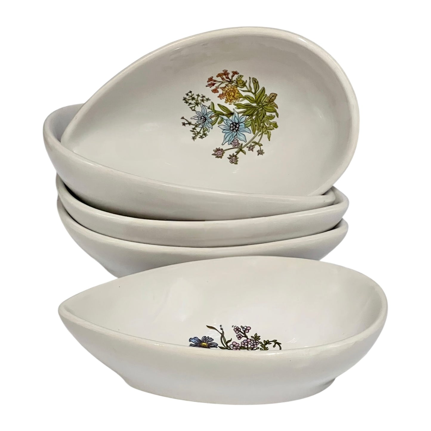 Set of ceramic avocado bowls with floral patterns on a white background
