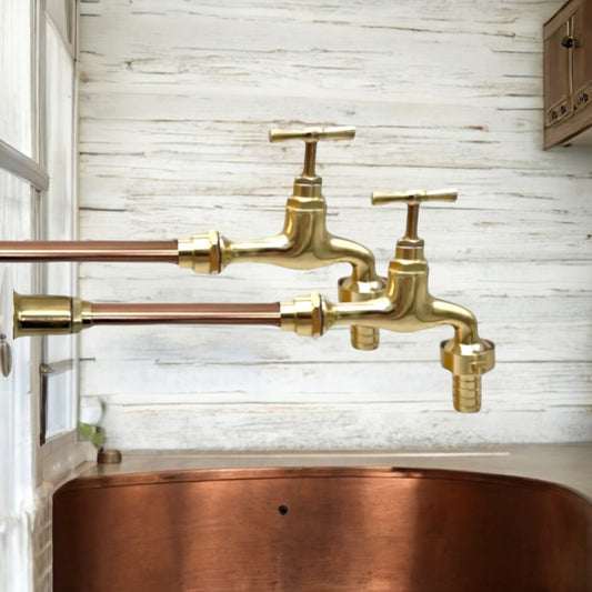 Pair of copper and brass wall mounted taps over a copper basin or sale from All Things French Store
