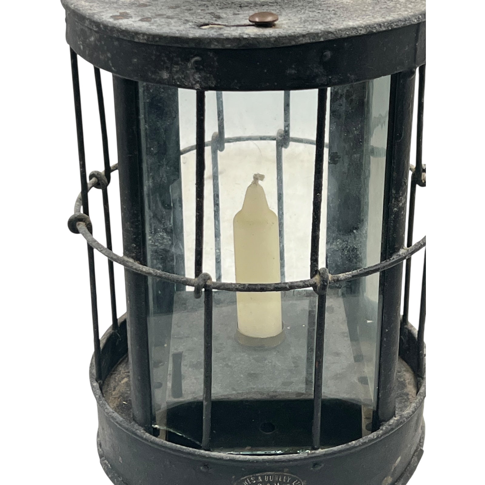 Vintage lantern with a glass cover and metal frame on a white background