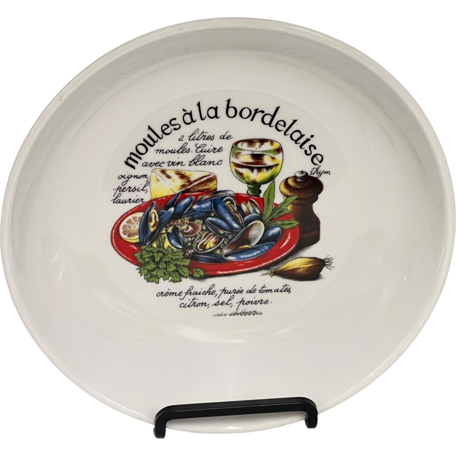 Ceramic plate with mussels illustration and text on a white background