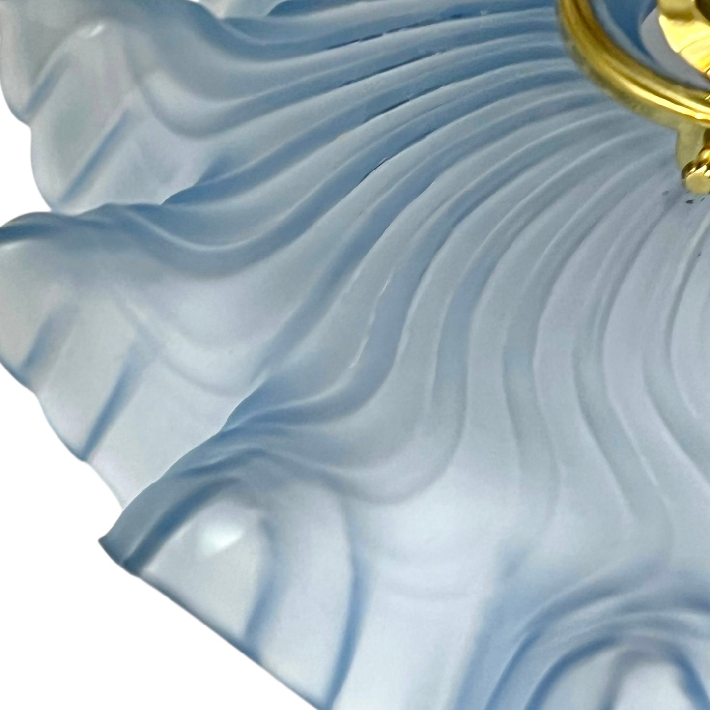 Close-up of a blue textured glass lampshade
