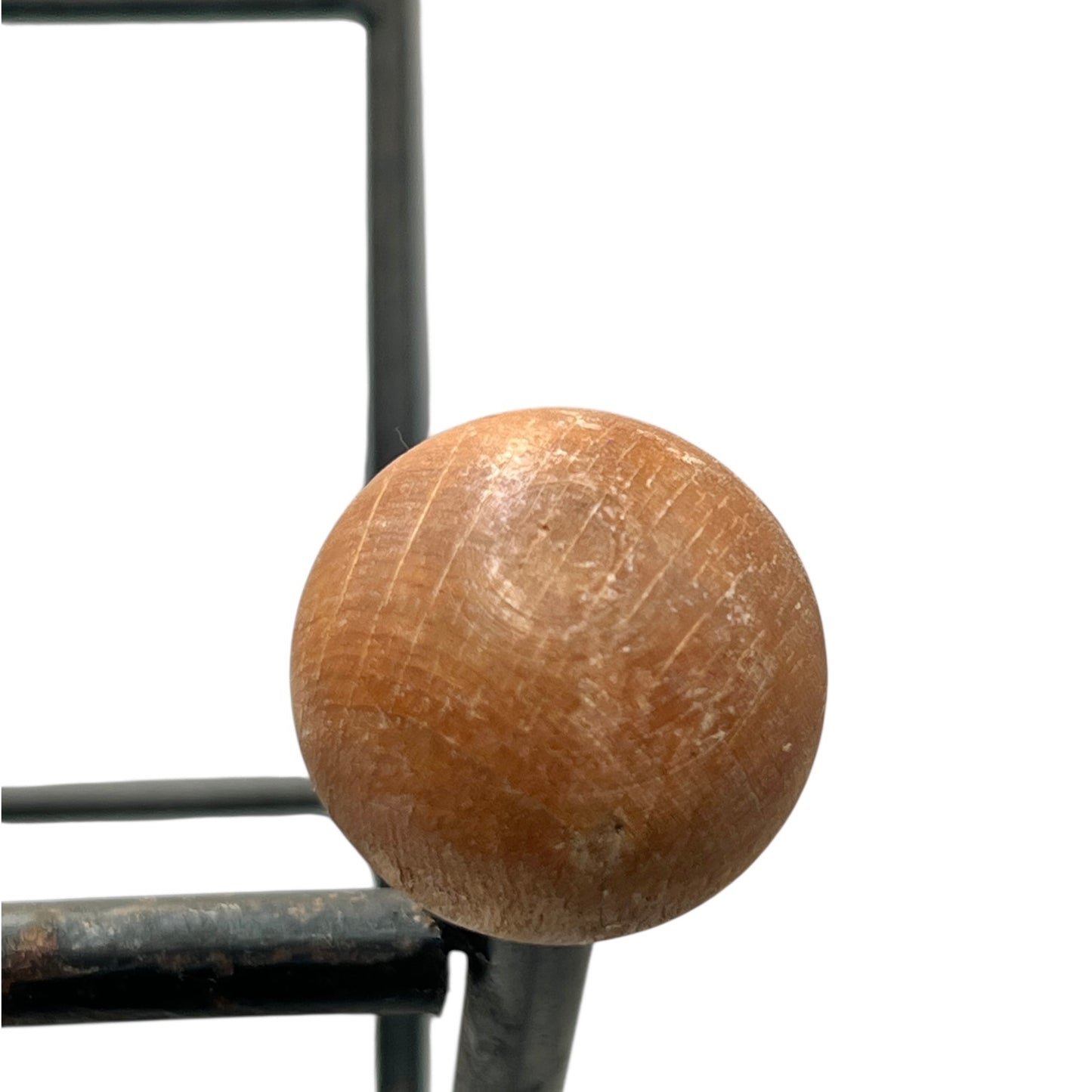 Close-up of a black metal stand on a white background