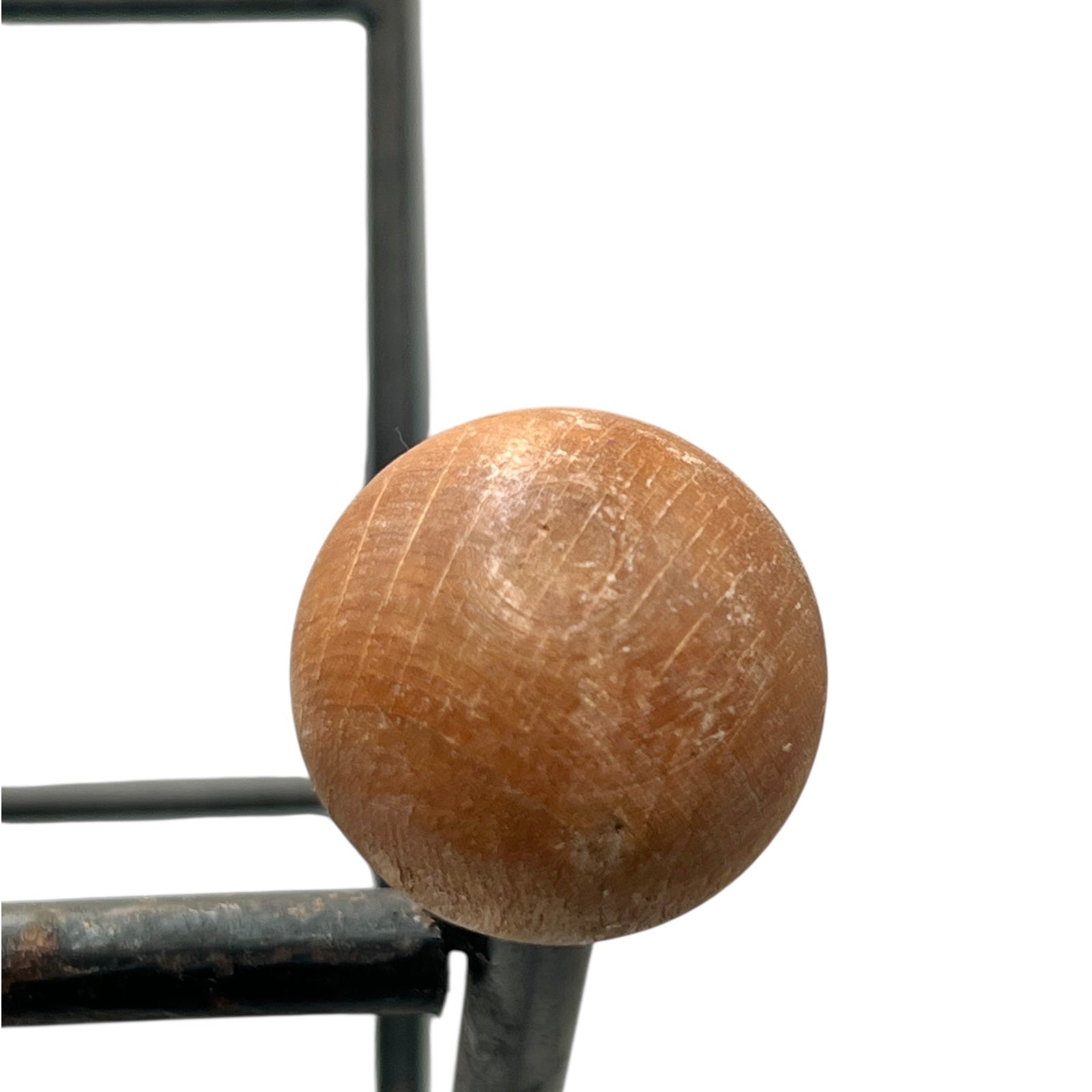 Close-up of a black metal stand on a white background