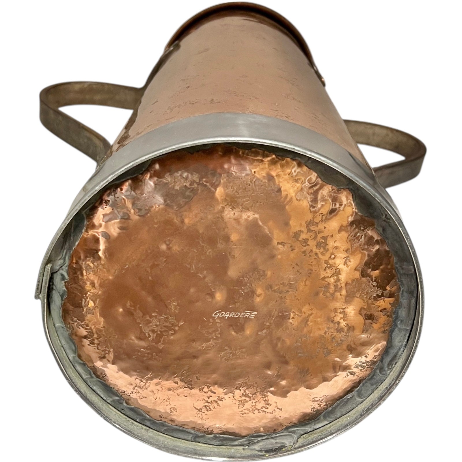 Close-up of a copper milk churn with a chain handle on a white background