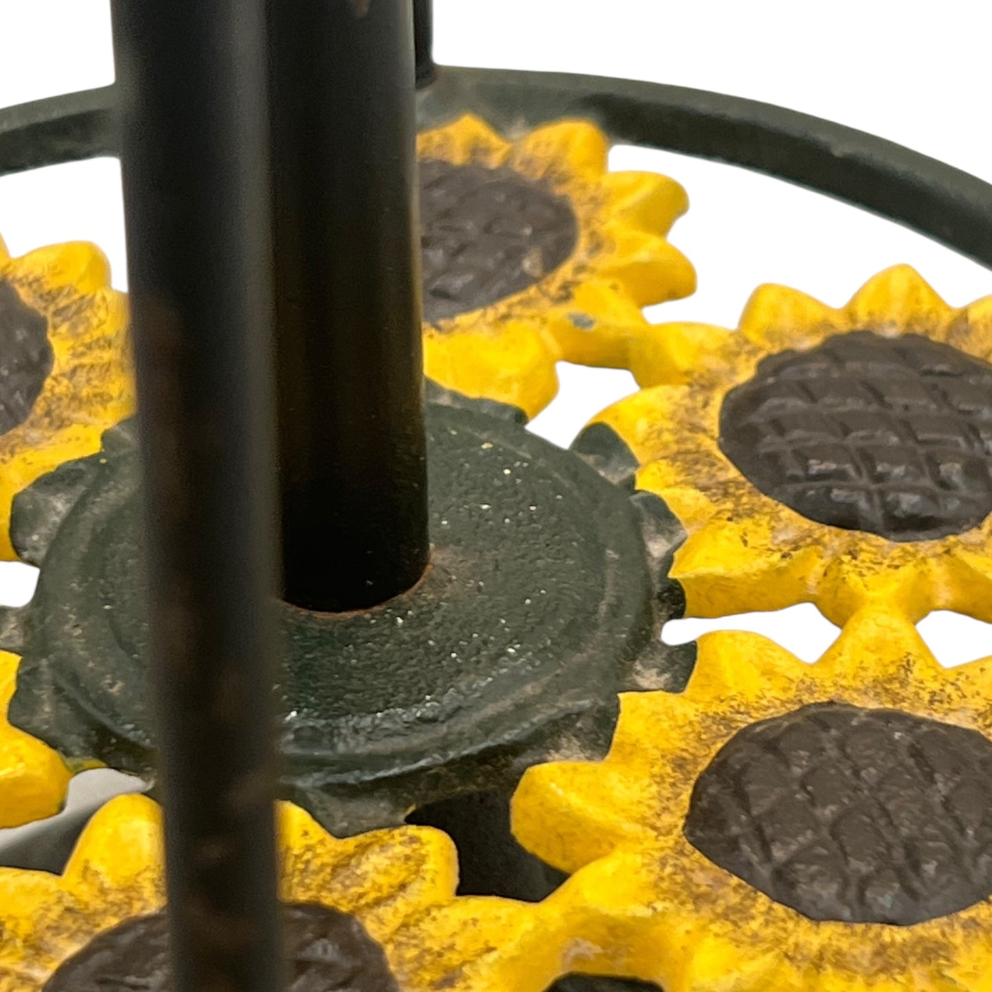 Close-up of a sunflower decoration on a kitchen paper towel stand on a white background