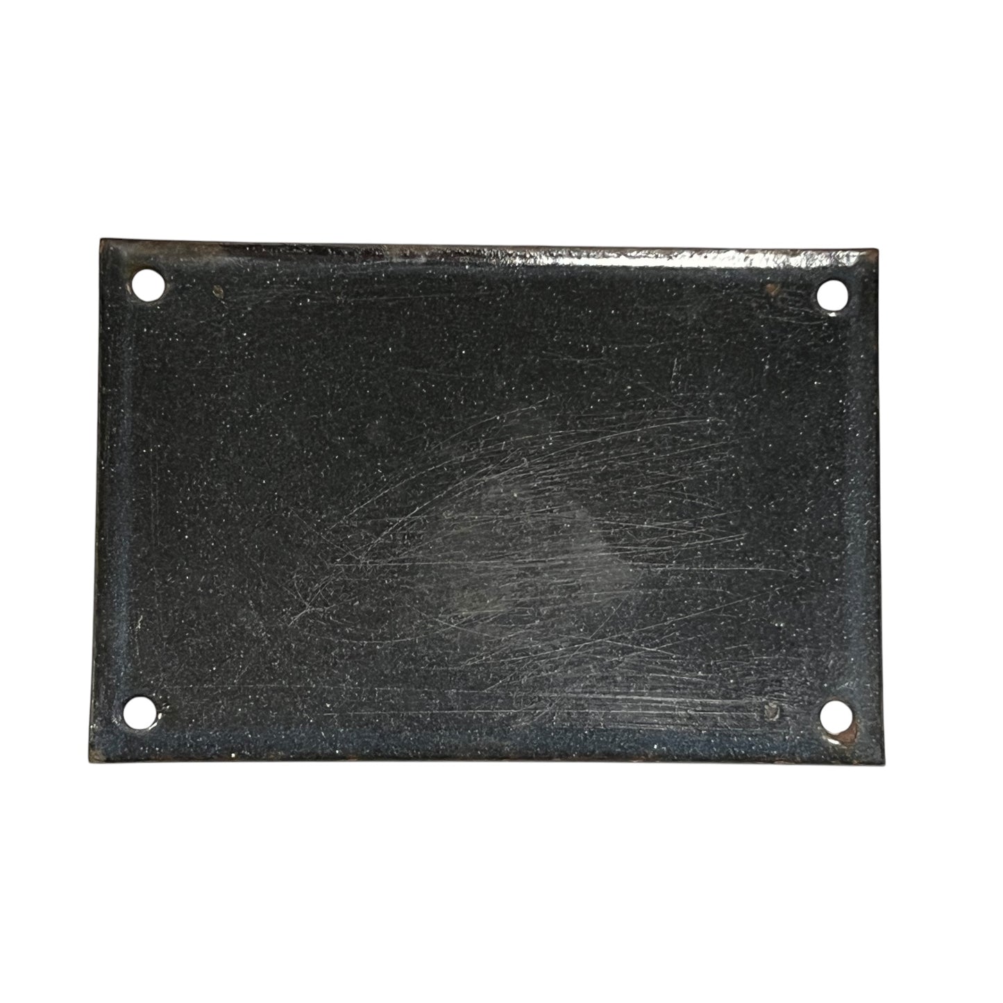 Rectangular black metal plate with holes on a white background