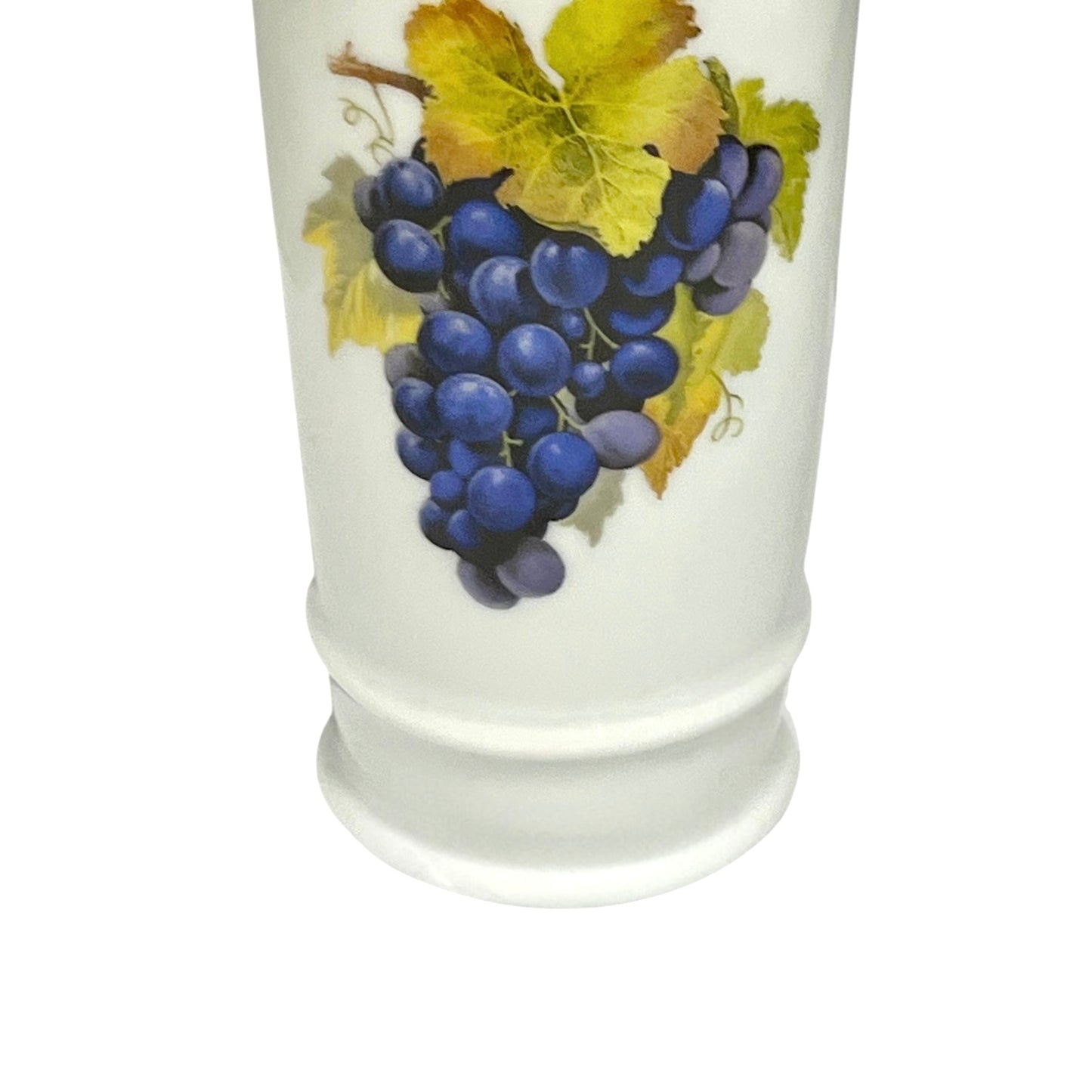Ceramic decanter with a design of grapes and leaves on a white background