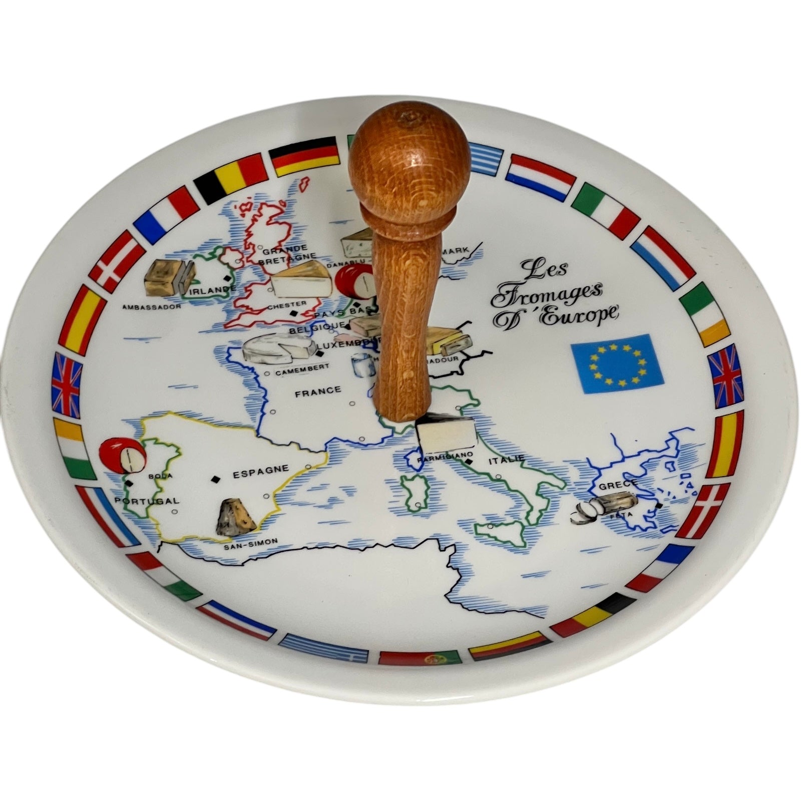 Decorative cheese plate with a map of Europe and wooden handle on a white background