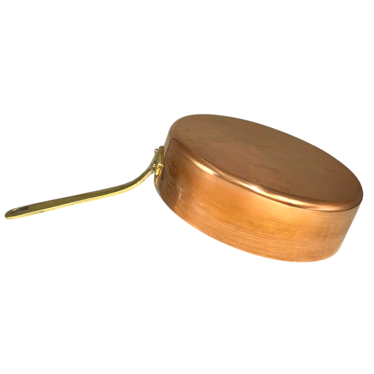copper frying pan with a gold handle on a white background