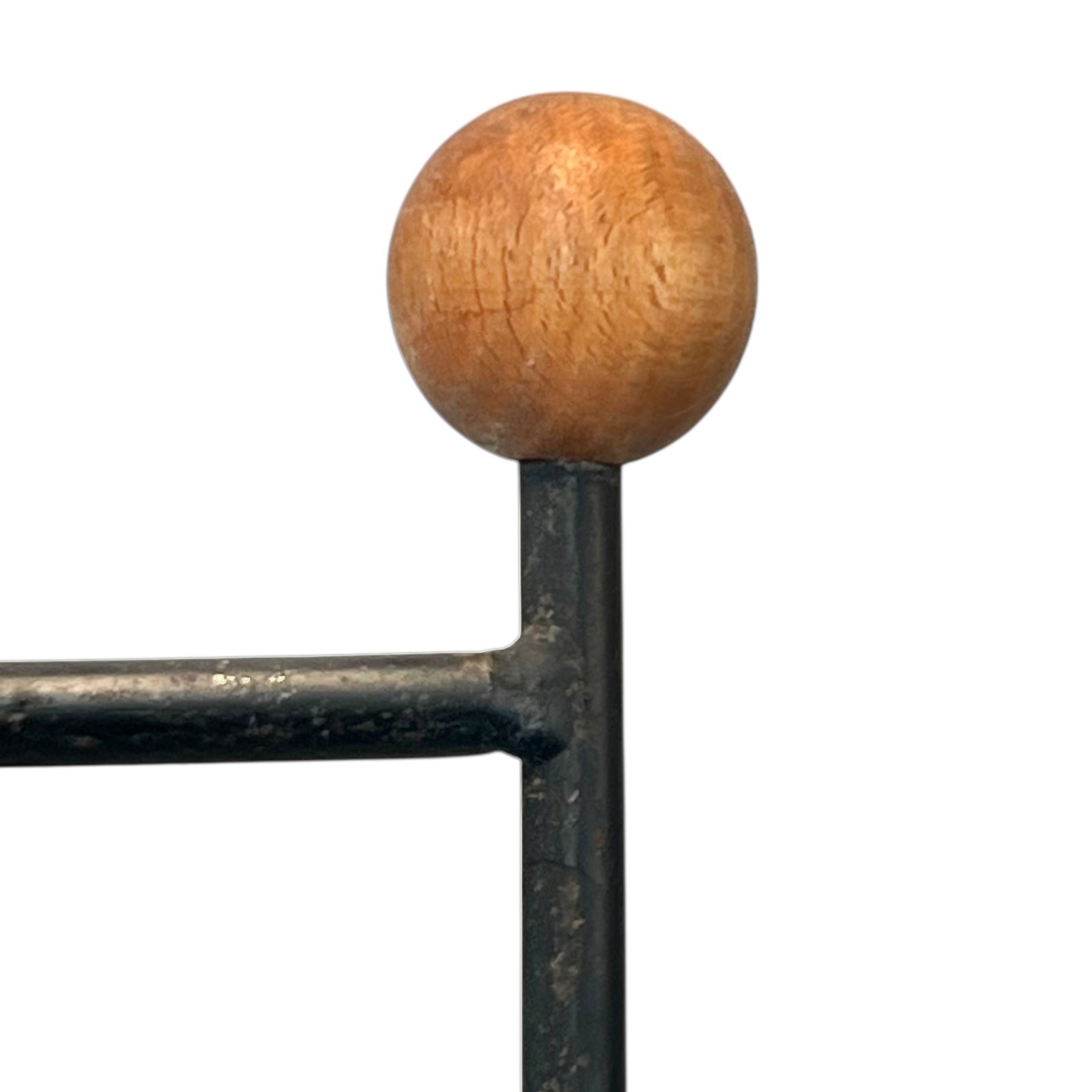 Close-up of a black metal stand on a white background