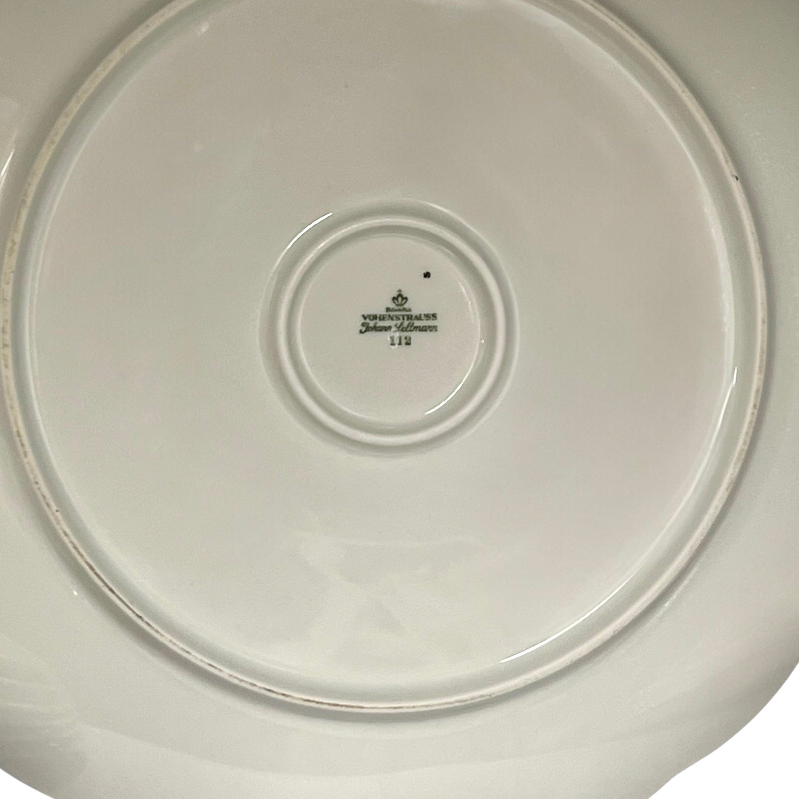 Back of a French plate on a white background