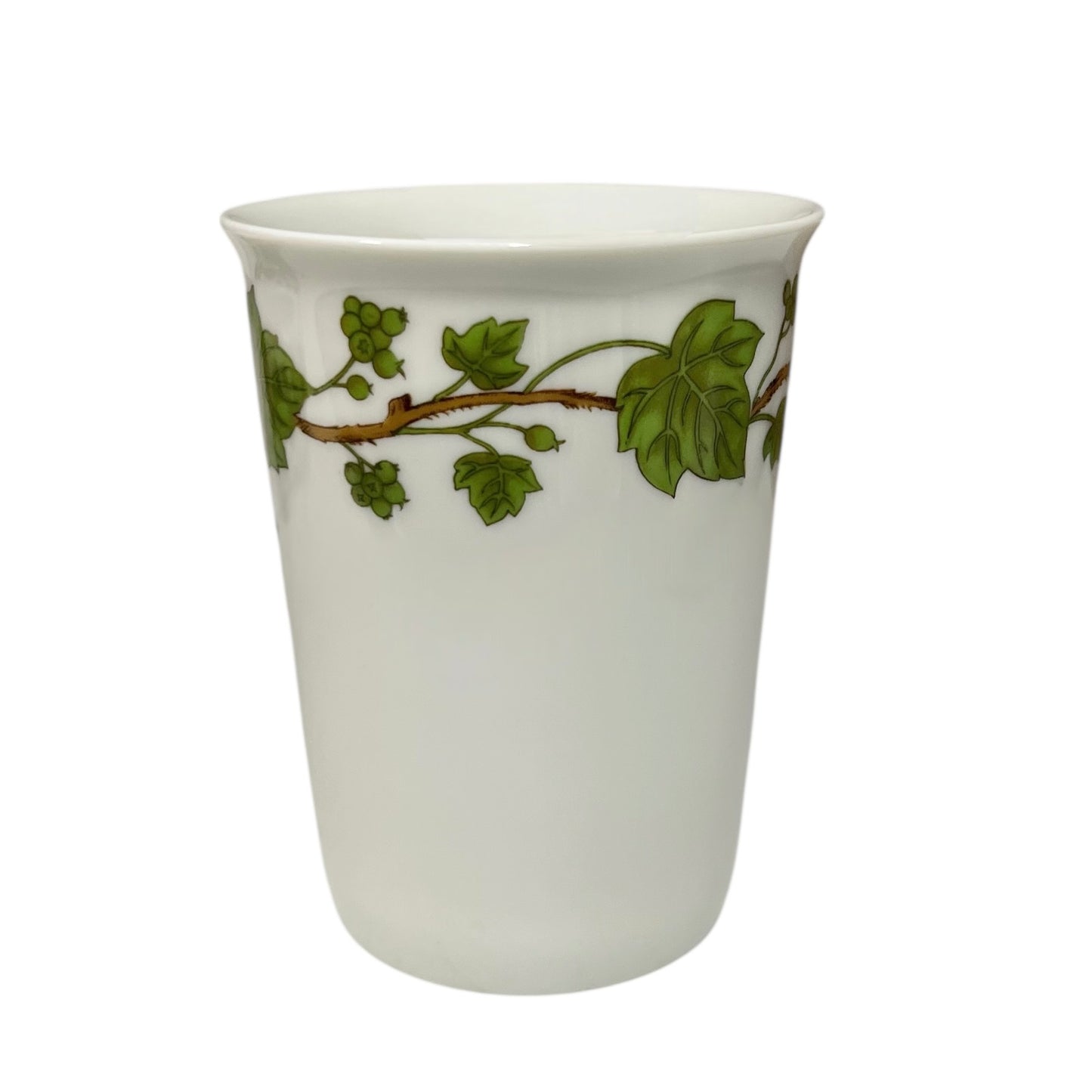 Porcelain bathroom tumbler featuring green leaf patterns on a white background