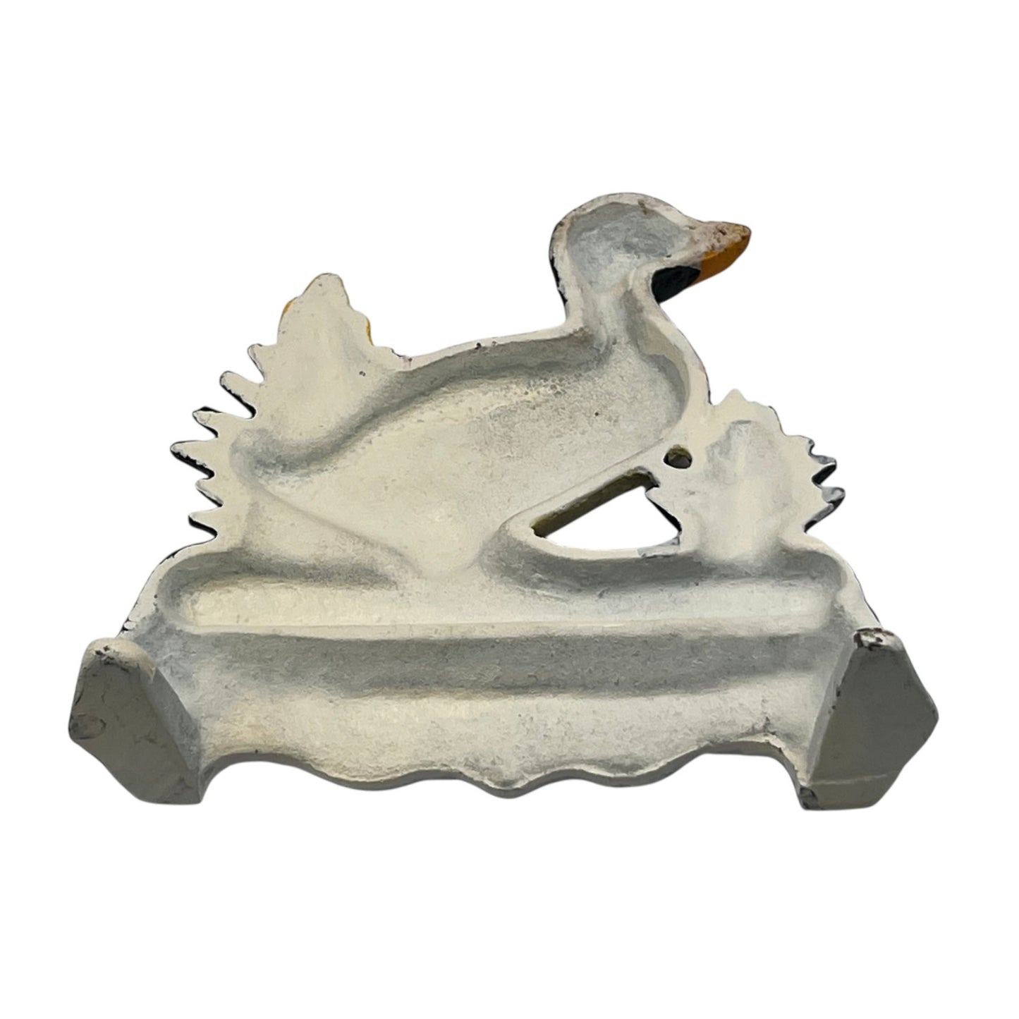 Close up of duck doorstop on a decorative stand with a white background