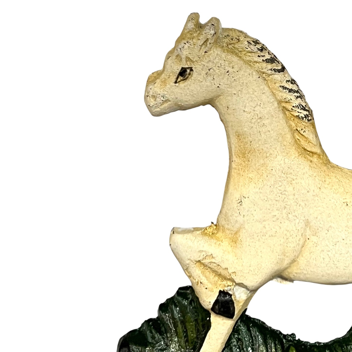 Close up of white horse toilet paper holder against a white background