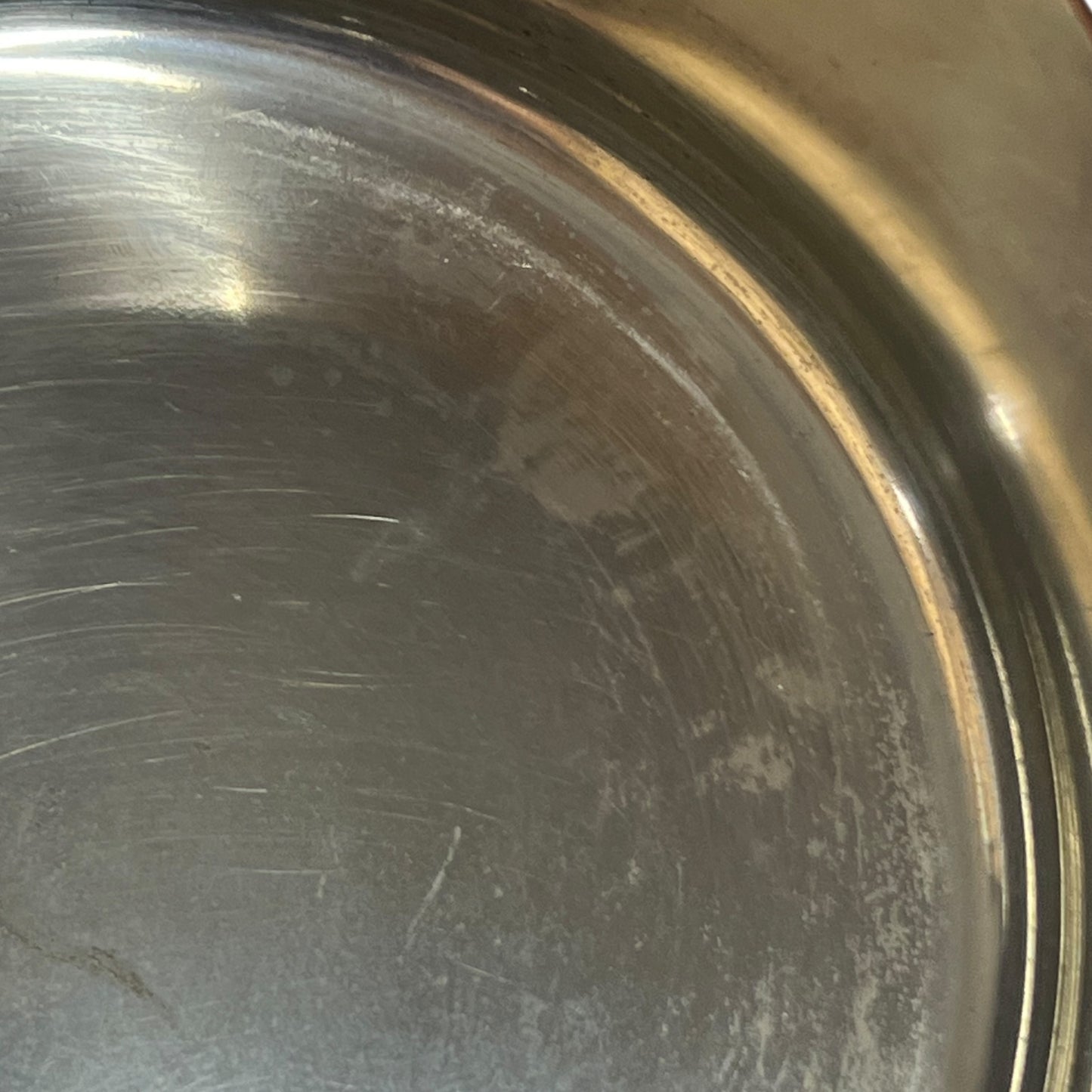 close up inside image of tin lined copper pan