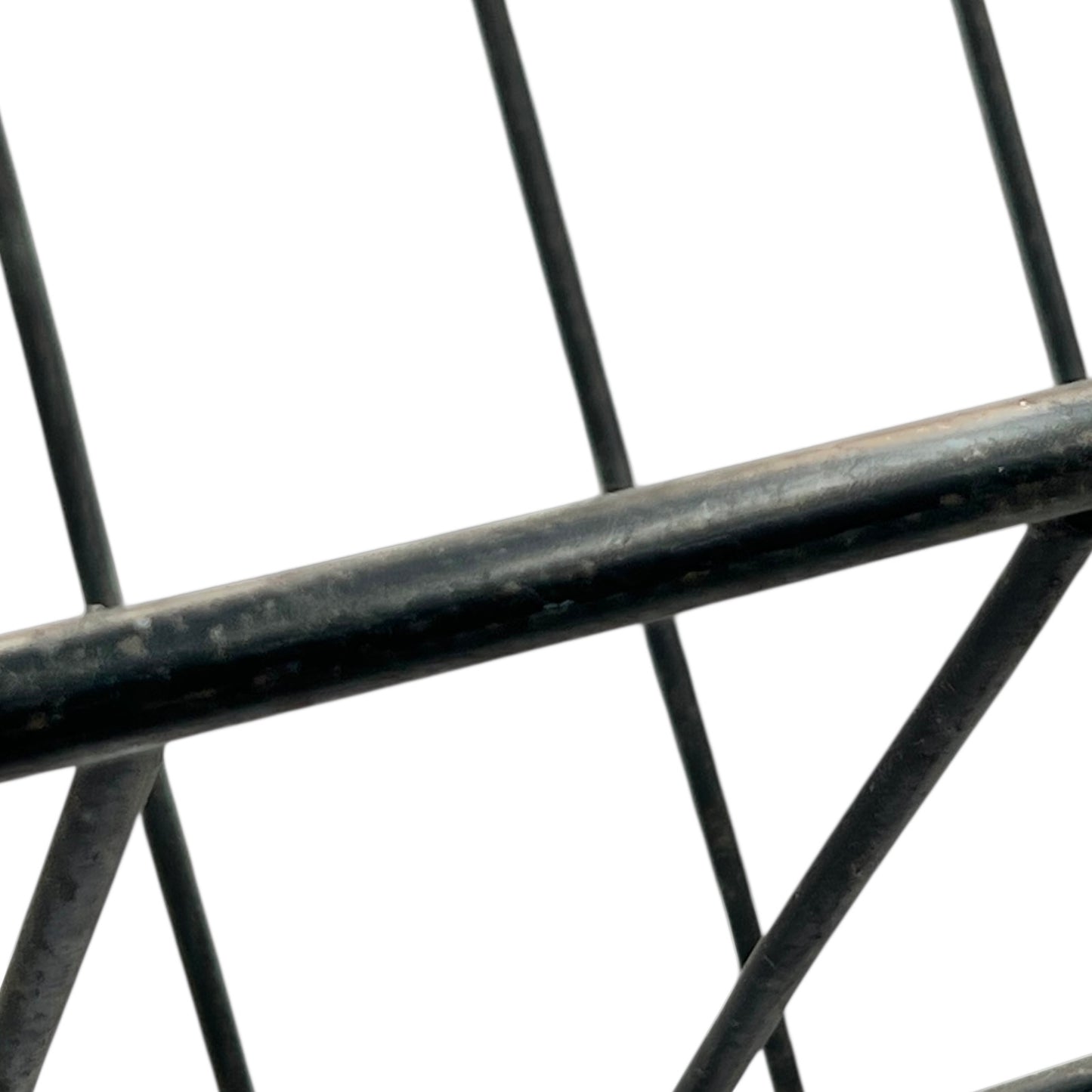 Close-up of a black metal stand on a white background