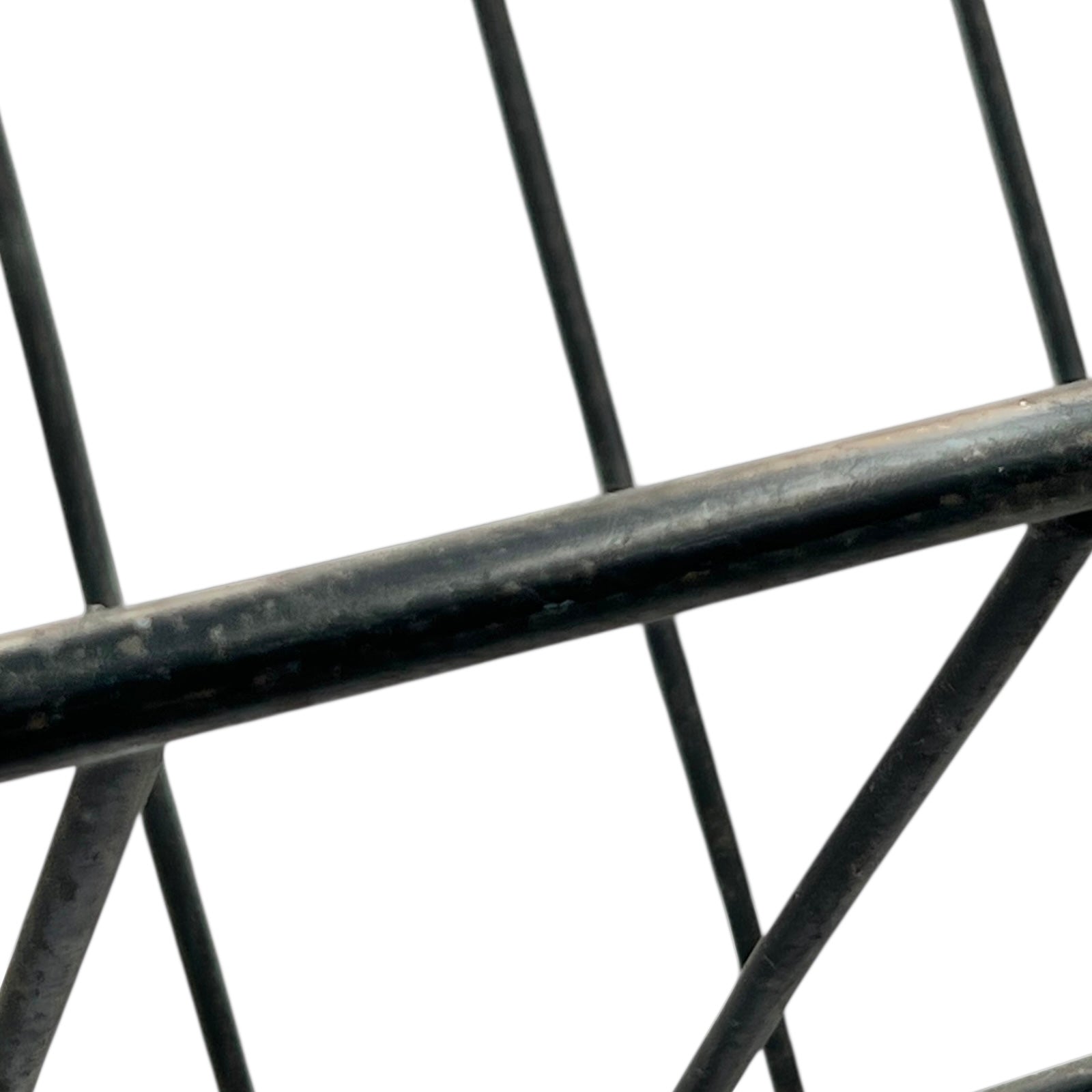 Close-up of a black metal stand on a white background