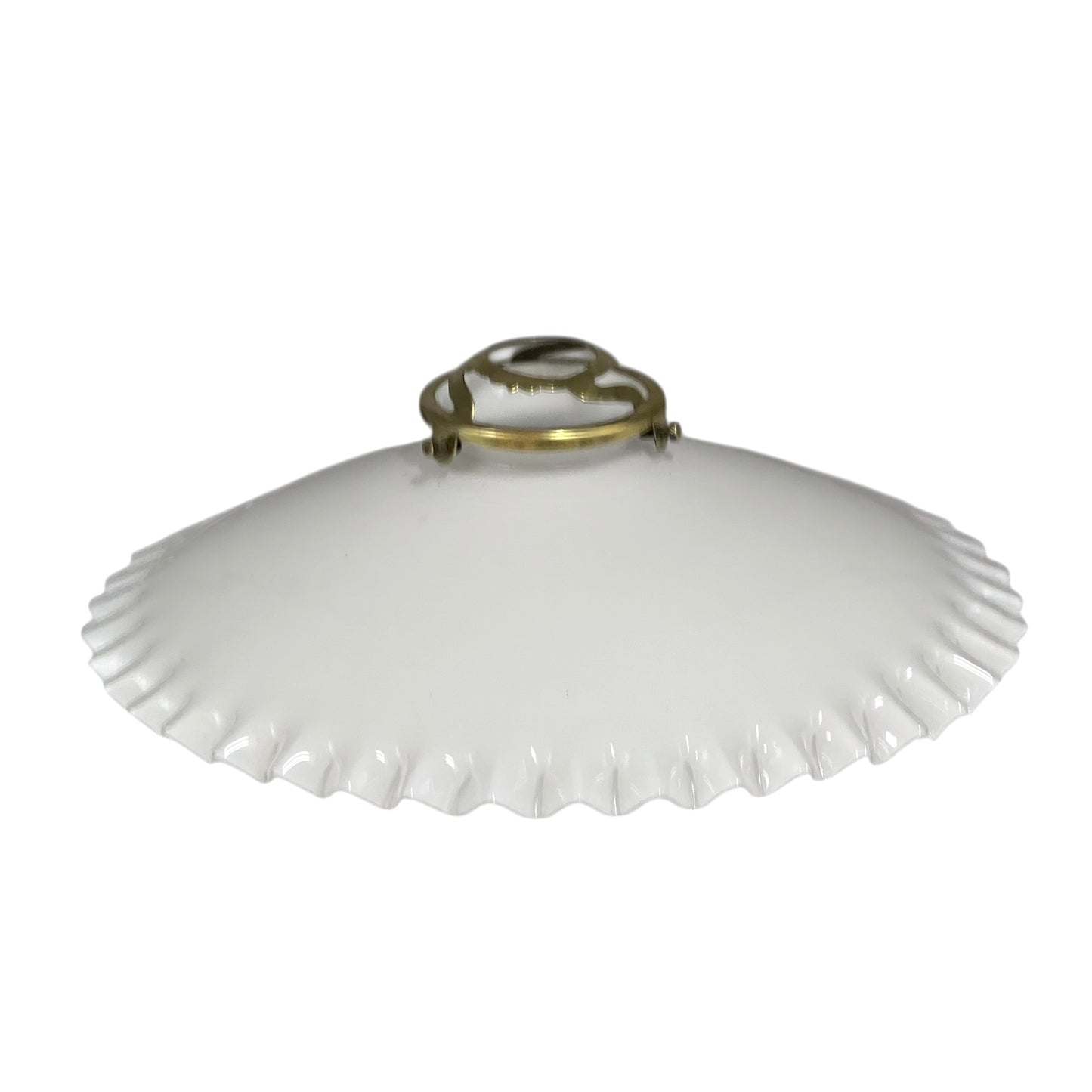 White lampshade with scalloped edge and brass fitting on a white background