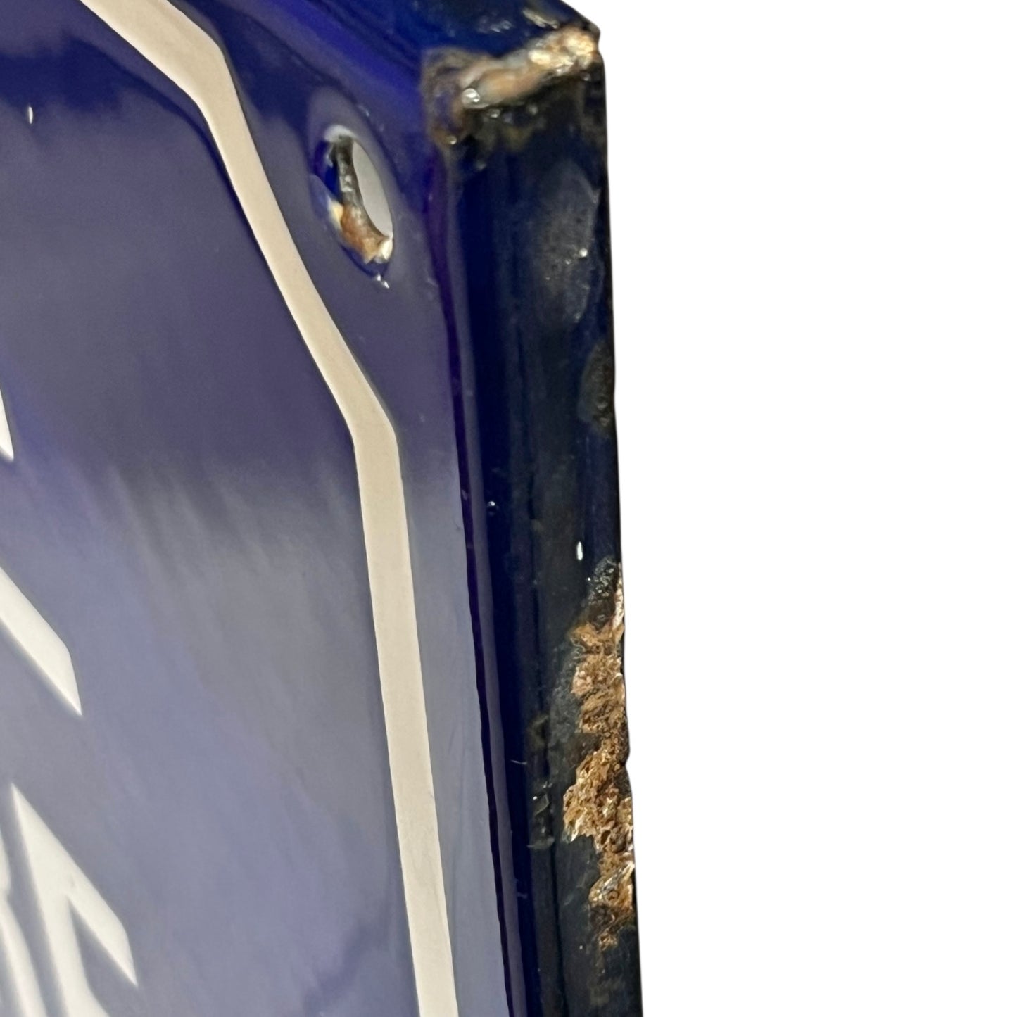 Close-up of a blue and white sign on a white background