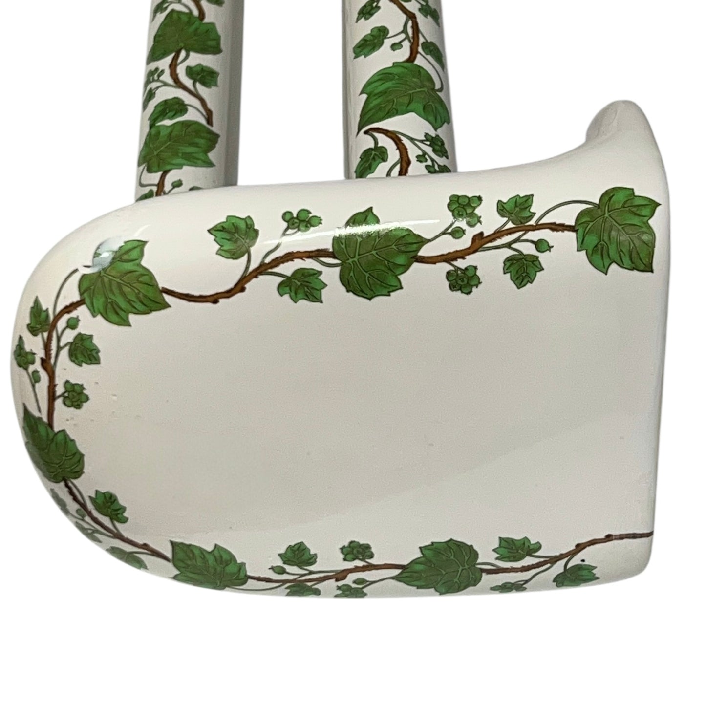 White and green leaf patterned towel rails and end brackets on a white background