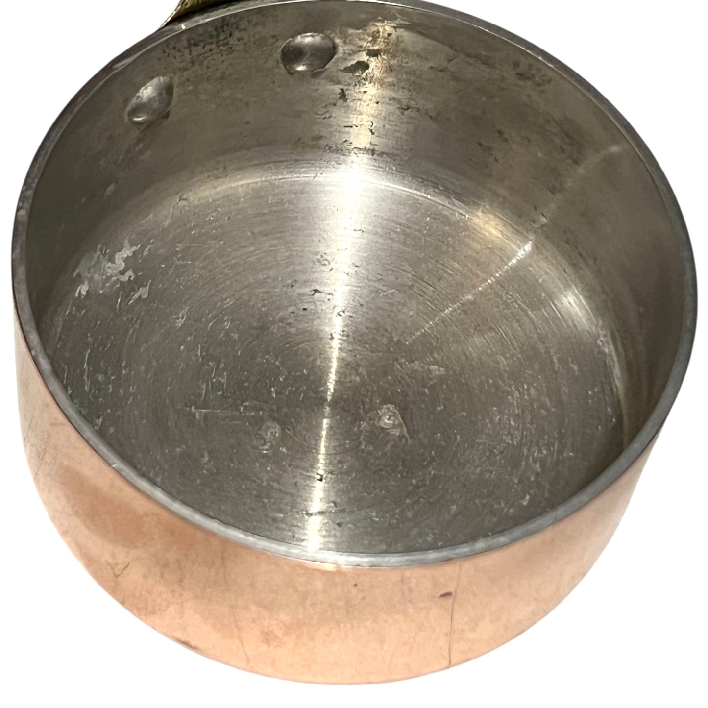 close up inside image of copper pan