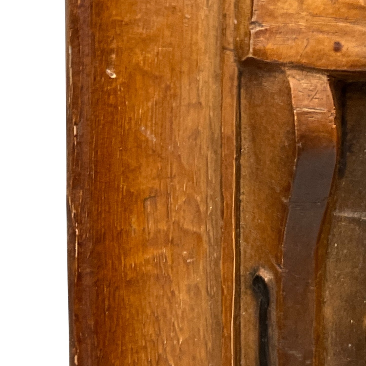 close up of wooden relief sculpture in an arts and crafts style on a white background