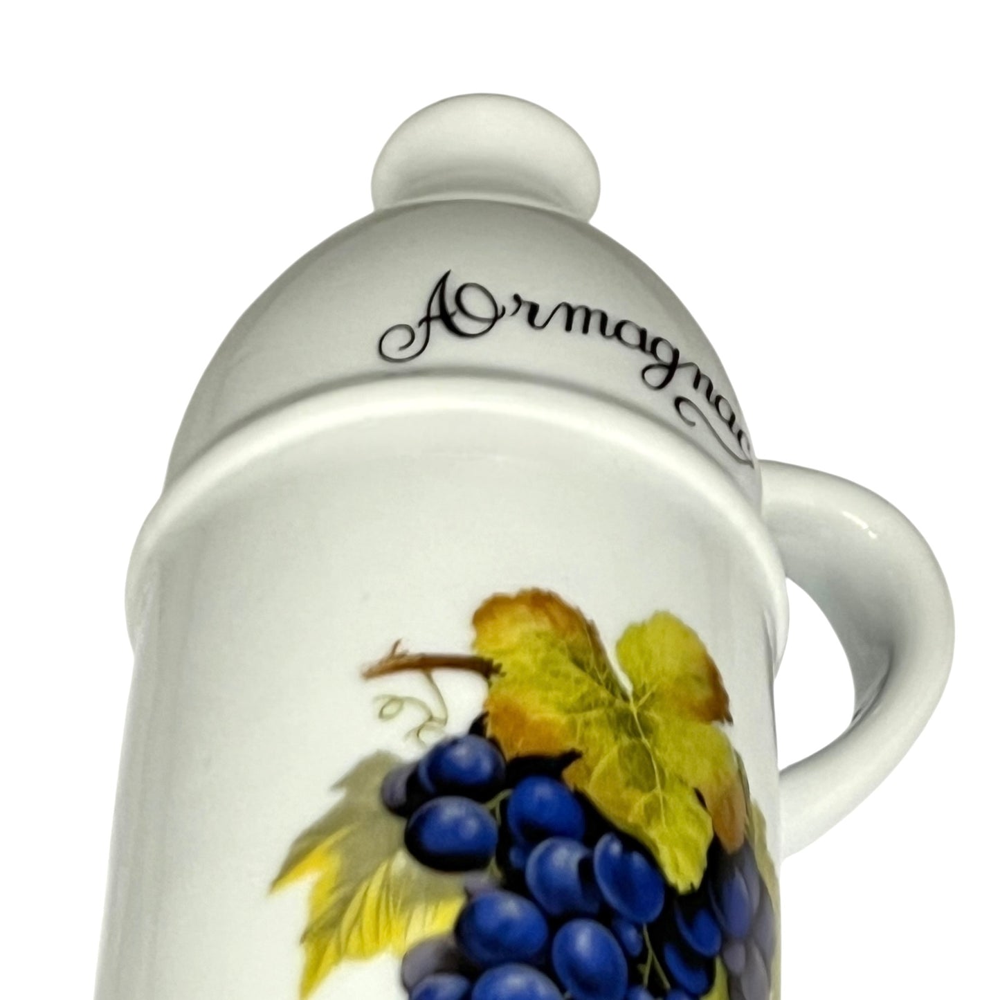 White ceramic container with 'Armagnac' text and grape design on a white background
