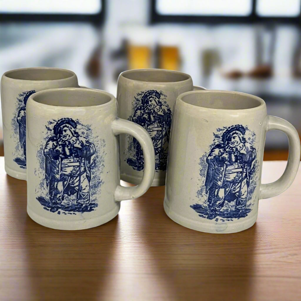 set of 4 grey ceramic beer steins with a blue pattern on the front