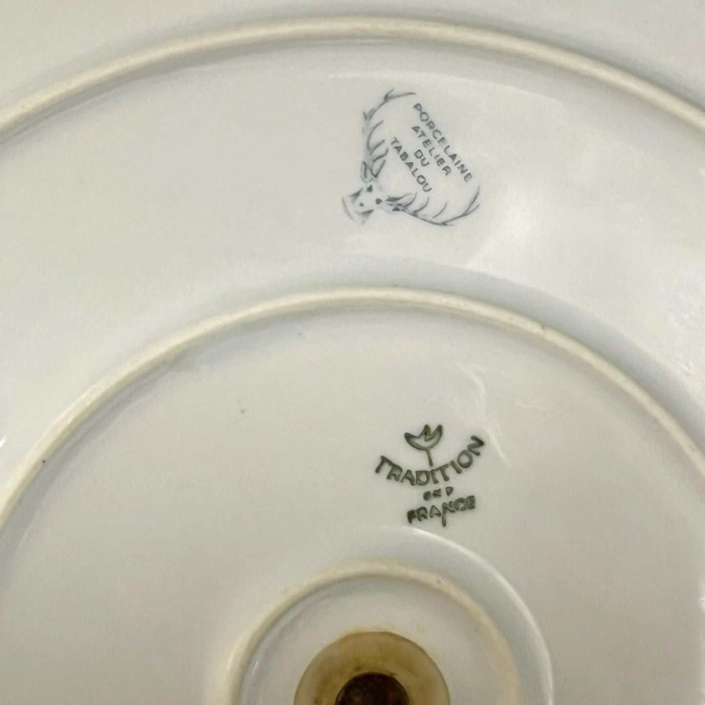 back of a French cheeseboard with a makers stamp on a white background