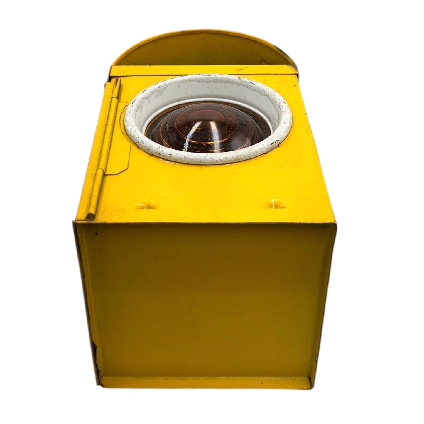 Close up of yellow vintage railway or railroad lamp with orange glass panels and a hook on a white background