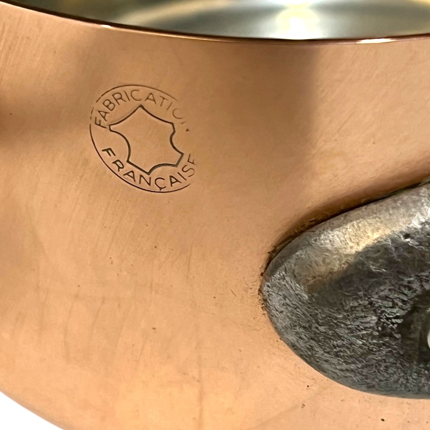 cast iron handle and Fabrication Francais stamp of copper pan