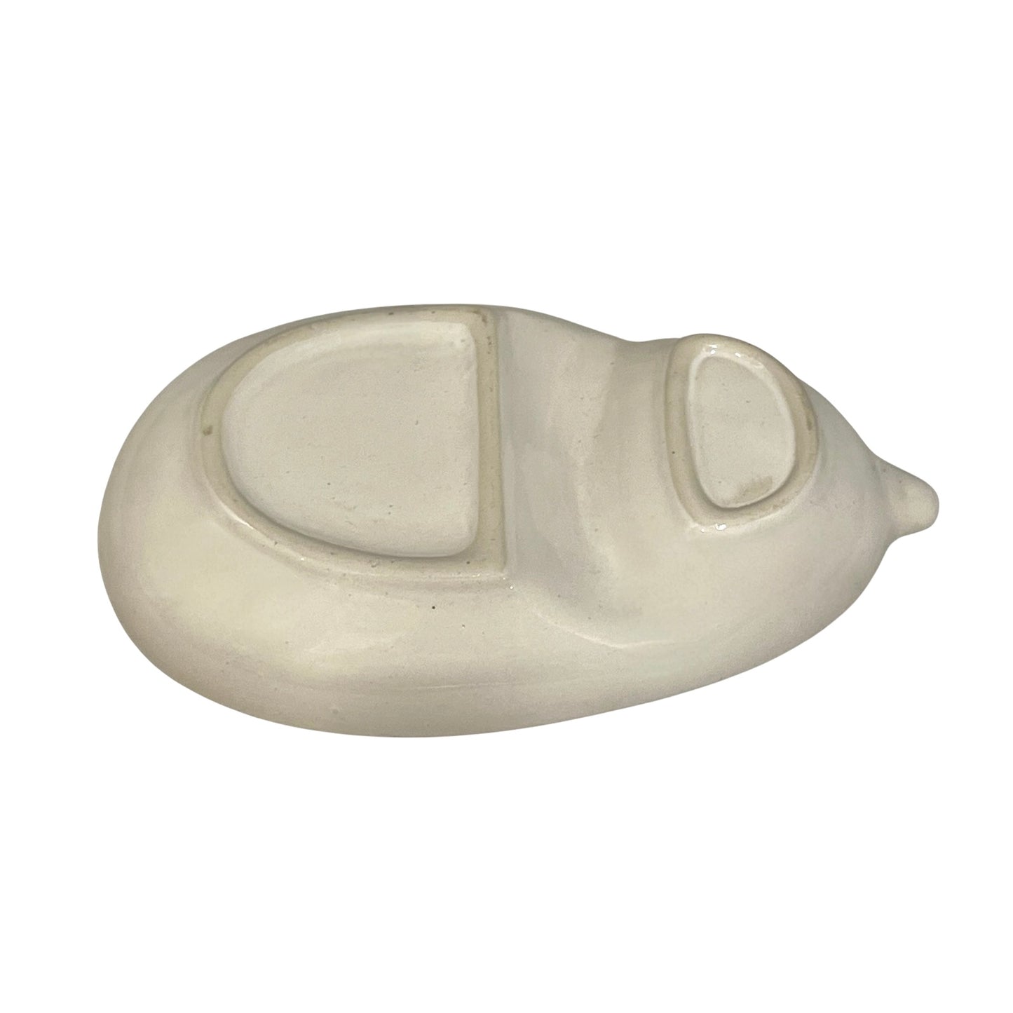 White ceramic oval object on a white background