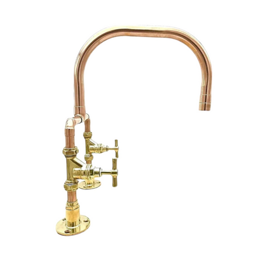 Copper and brass kitchen faucet on a white background