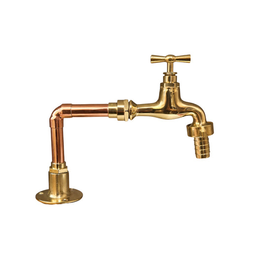 Brass and copper faucet on a white background