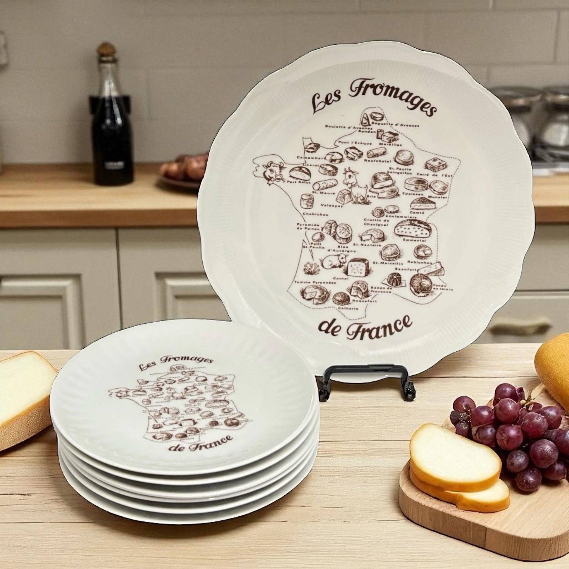 Set of white plates with cheese diagram design on a kitchen counter.