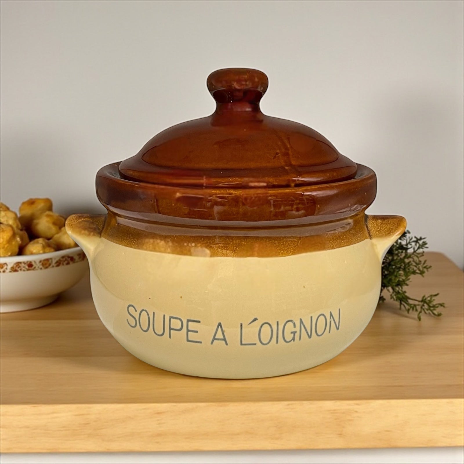 Ceramic pot with lid labelled 'Soupe a l'Oignon' in a rustic kitchen for sale from All Things French Store