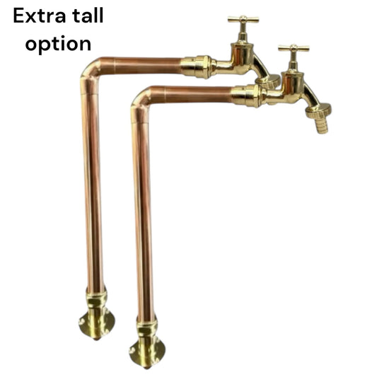 Pair of heritage stye copper and brass tall handmade taps with detachable taps on a white background