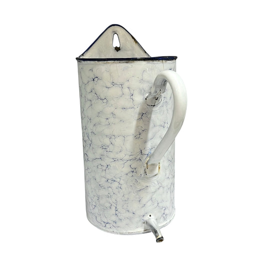 A vintage-style enamel planter with a white and blue marble pattern, featuring a white handle, a top hanging loop, and a small metal spout at the bottom.