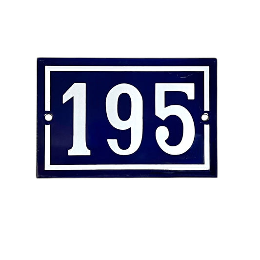 Navy blue rectangular enamel plate with white numbers '195' on a white background