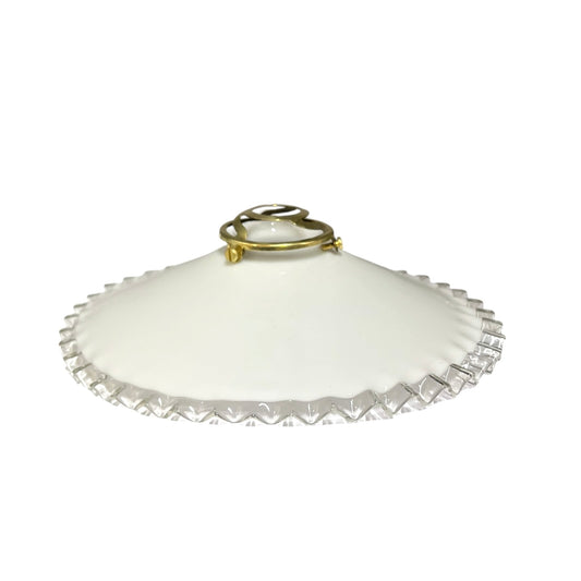 French vintage milk glass pendant lampshade with a brass collar set on a white background